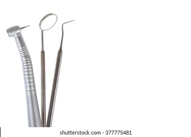 Dental mirror, dental sonde and turbine. Image isolated on white background. Located on the side with a place to insert text