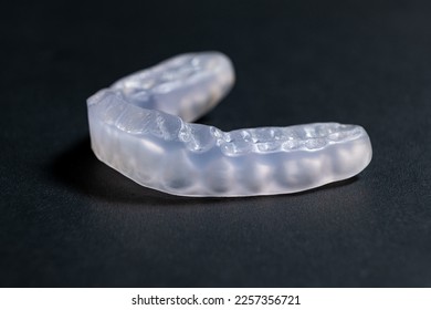 Dental mouthguard, splint for the treatment of dysfunction of the temporomandibular joints, bruxism, malocclusion, to relax the muscles of the jaw - Shutterstock ID 2257356721