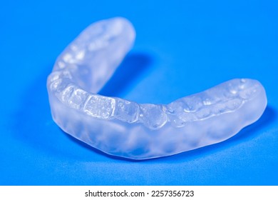 Dental mouthguard, splint for the treatment of dysfunction of the temporomandibular joints, bruxism, malocclusion, to relax the muscles of the jaw - Shutterstock ID 2257356723