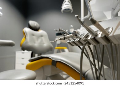 a dental office white sterile ready for robots yellow chair for the patient and white equipment - Powered by Shutterstock