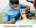 dental procedure, dentist chair, Dental treatment, Young lady lying, female patient, Dentist examining, treating teeth,