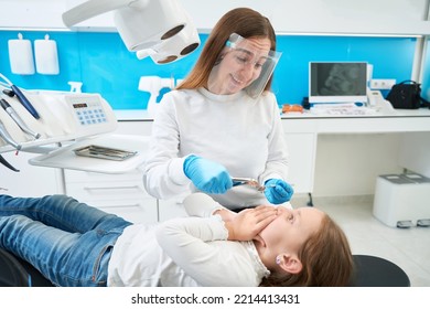 Dental Surgeon Laughing At Capricious Little Patient