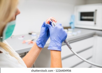 Dental Technician Making Dentures. Dental Prosthesis, Prosthetics Work.