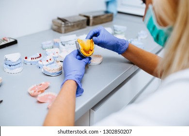 Dental Technician Making Dentures. Dental Prosthesis, Prosthetics Work. 