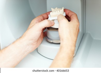 Dental Technician Placing A Dental Model In A 3D Scanner