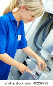 Dental Technician Working On A CAD CAM