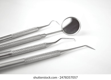 Dental tools on white background – Wales, UK - Powered by Shutterstock