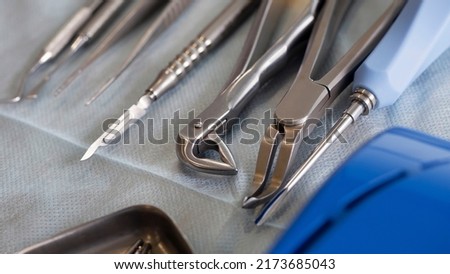 dental tools for tooth extraction on the surgical table before the operation