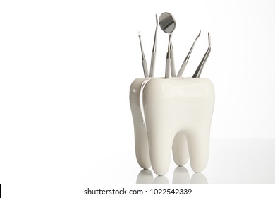 Dental Tooth Model With Metal Medical Dentistry Equipment Tools For Teeth Dental Care Isolated On White Background With Copy Space, Close-up. Oral Dental Hygiene Concept