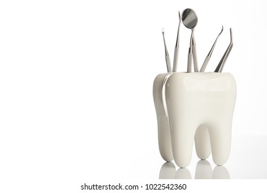 Dental tooth model with metal medical dentistry equipment tools for teeth dental care isolated on white background with copy space, close-up. Oral dental hygiene concept - Powered by Shutterstock