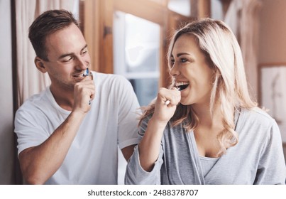 Dental, toothbrush and couple brushing teeth in bathroom with smile for oral hygiene, fresh breath or morning routine. Home, wellness and happy woman with man for whitening, cleaning or mouth care - Powered by Shutterstock