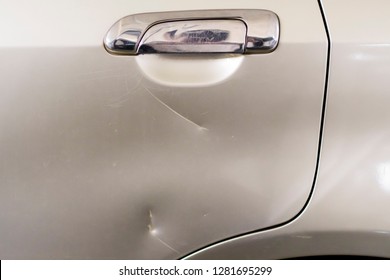 dented on door of car