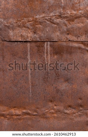 dented rusty overlapping metal sheets texture and full-frame background with rust cavities