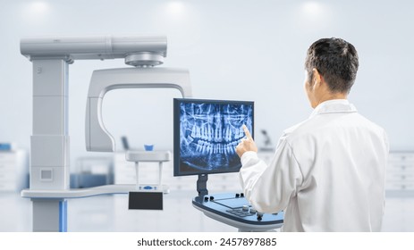 Dentist analyze digital x-ray film from scanner machine in 3d rendering hospital room - Powered by Shutterstock