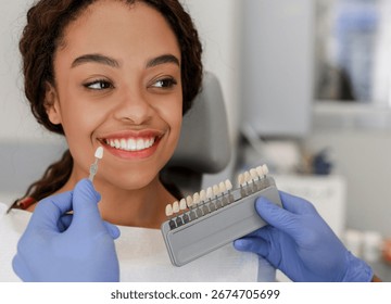 Dentist applying sample from tooth scale to patient teeth
