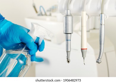 A Dentist Is Cleaning With Spray Sanitizer The Tools Of The Dental Chair For Avoid The Coronavirus Disease