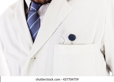 A Dentist With Dental Instruments In The Pocket Of The White Lab Coat