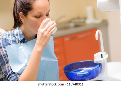 At The Dentist Dental Patient Woman Rinse Mouth After Treatment