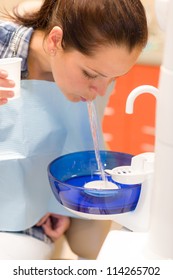 At The Dentist Dental Patient Woman Spit Water After Treatment