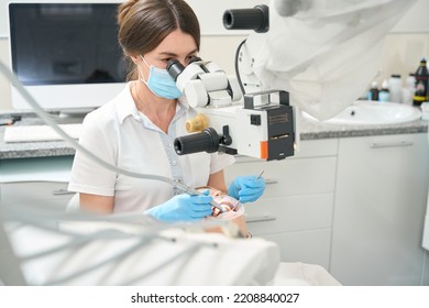 Dentist Doing A Comprehensive Teeth Cleaning To A Patient