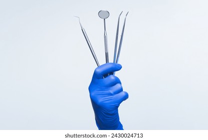 Dentist equipment in hand, banner. Dental care concept. Dentist tools, medical equipment, isolated. Dental clinic concept. Dental Insurance. Dentist Teeth Mirror. Medical Dentist Tool. Dental Health. - Powered by Shutterstock