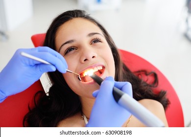 Dentist Examines Baby Girl's Teeth.Prophylaxis Of Caries, Milk Teeth, Pediatrics