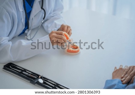 Dentist explaining about the teeth.