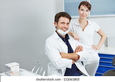 Dentist And Female Dental Assistant Together In A Dentistry