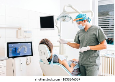 Dentist with female patient in a modern dental clinic explaining the procedure. Dentistry concept.