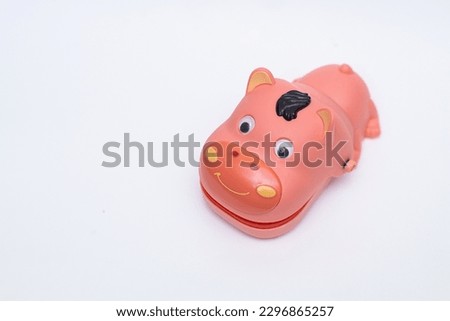 Dentist Finger Bite or Tricky Toy on Isolated White Background. High Angle