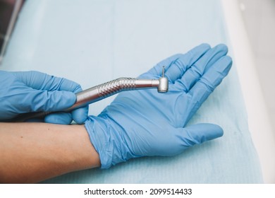 Dentist Hand Latex Glove New High Speed Dental Handpiece Medical Instrument Concept - Powered by Shutterstock