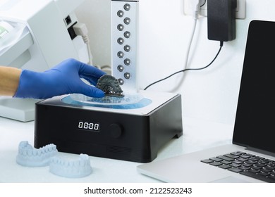 Dentist Holds A 3d Print Of The Jaw.