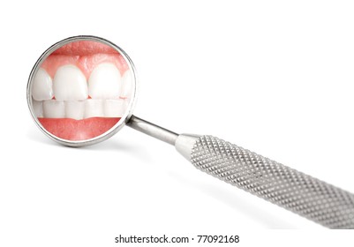 Dentist Mirror With Reflection Of Teeth