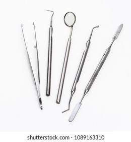 Dentist Office With Tools For Teeth Care At White Background Top View Close Up Macro