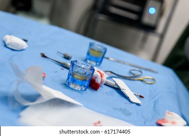 Dentist operating, instruments