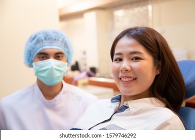 Dentist and the patient are preparing to treat carious teeth in the dental clinic - Shutterstock ID 1579746292