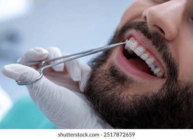 Dentist performing examination with specialized tools during routine dental checkup - Powered by Shutterstock