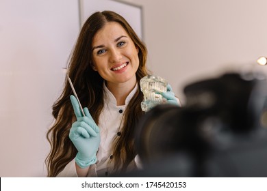Dentist practicing work on tooth model - Shutterstock ID 1745420153