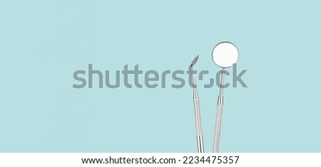 Dentist Professional tools medical equipment on Blue background. Dental Hygiene and Health conceptual image Dental tools on blue background. Medical technology concept