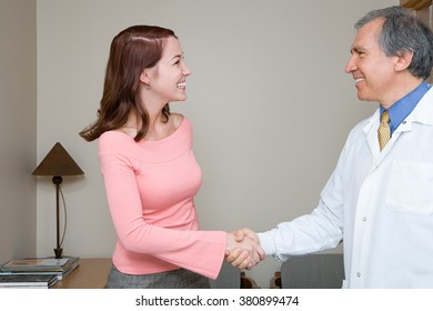 Dentist Shaking Hands With Patient