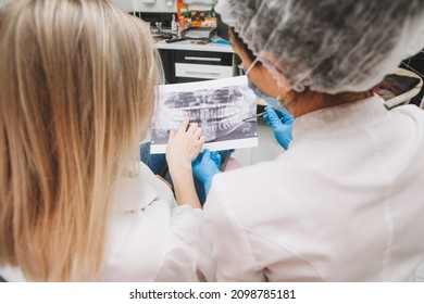 The Dentist Shows The Patient An X-ray. Computer Diagnostics. Dental Tomography