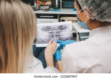 The Dentist Shows The Patient An X-ray. Computer Diagnostics. Dental Tomography