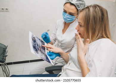 The Dentist Shows The Patient An X-ray. Computer Diagnostics. Dental Tomography