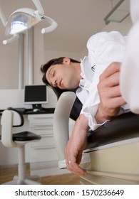 Dentist Sleeping In Dental Chair