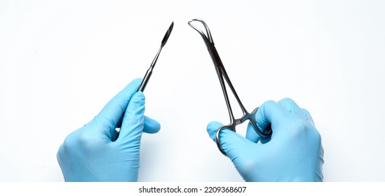 Dentist With Surgical Tools On White Background