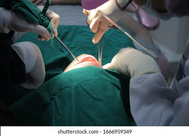 Dentist Suture Surgical Extraction Of Wisdom Tooth