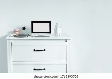 Dentist Table With Laptop And Teeth Model. Computer With Blank Screen On Dentist Table, Template For Design.