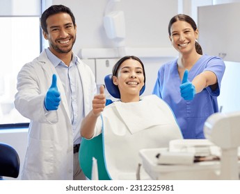 Dentist team, patient and thumbs up portrait for.consultation, clean or teeth whitening. Woman, asian man or healthcare staff and client together for dental care, oral health exam and mouth cleaning