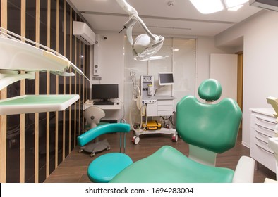 Dentist Tools And Children Dentistry Chair Waiting To Be Used By Orthodontist In Modern Hospital Interior, No People