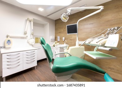 Dentist Tools And Professional Children Dentistry Chair Waiting To Be Used By Orthodontist, Modern Interior, No People